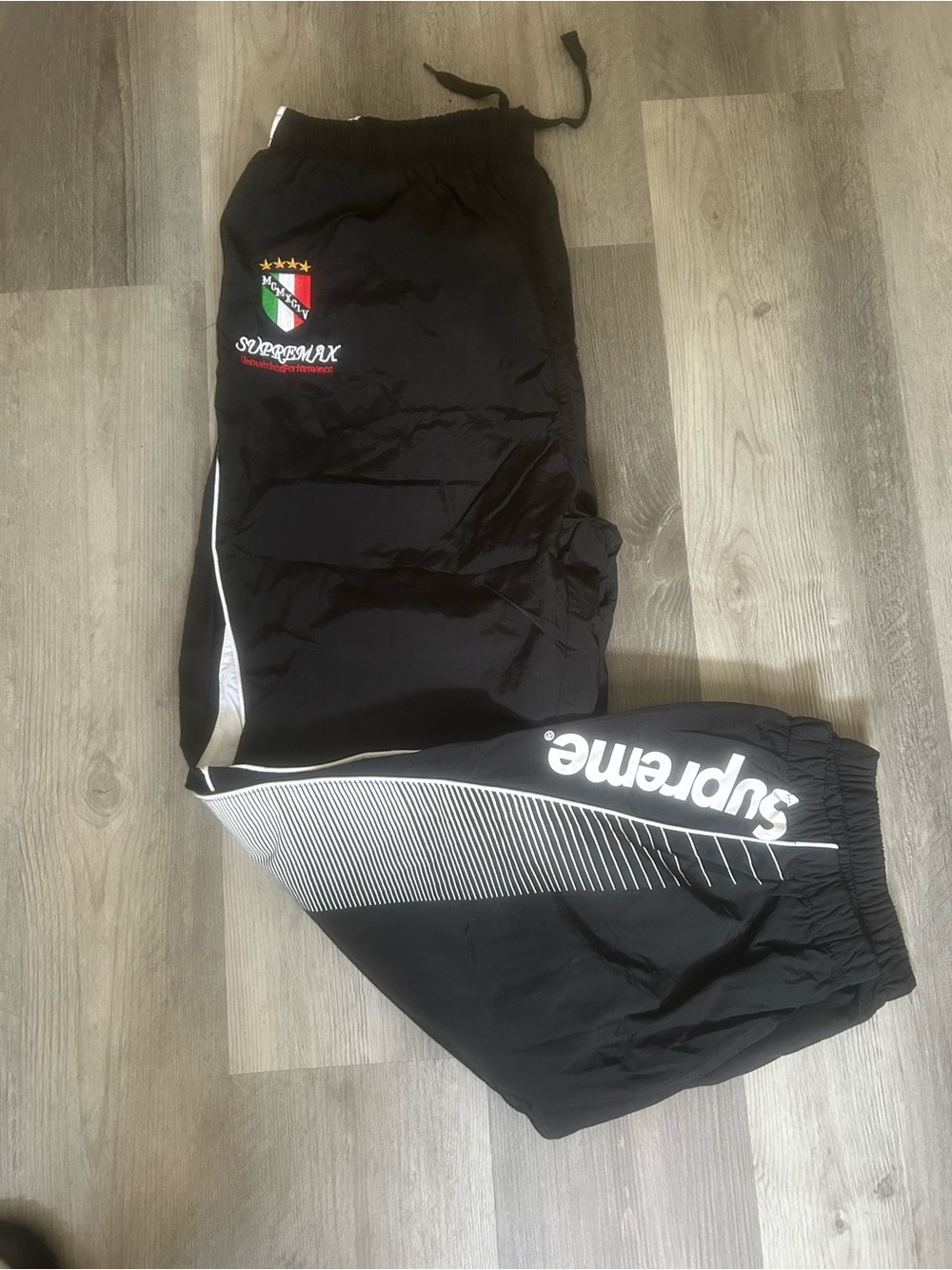 Supreme Black Track Pants with White Stripe and Logo